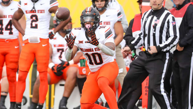 Oct 21, 2023; Morgantown, West Virginia, USA; Oklahoma State Cowboys wide receiver Rashod Owens (10) catches a pass during the first quarter against the West Virginia Mountaineers at Mountaineer Field at Milan Puskar Stadium. Mandatory Credit: Ben Queen-USA TODAY Sports